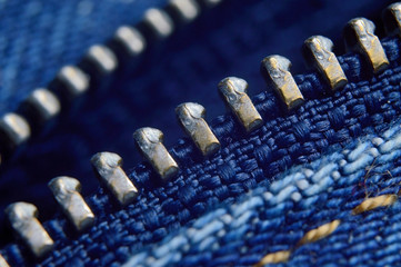 Closeup of blue jeans with open zipper