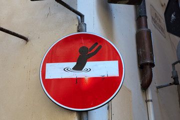 Firenze, Italy - April 21, 2017: Road sign defaced by street artist Clet Abraham, Florence,...