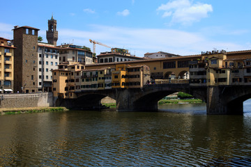Fototapeta premium Firenze, Italy - April 21, 2017: Ponte Vecchio and Arno River in Florence, Firenze, Tuscany, Italy