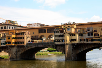 Fototapeta na wymiar Firenze, Italy - April 21, 2017: Ponte Vecchio and Arno River in Florence, Firenze, Tuscany, Italy