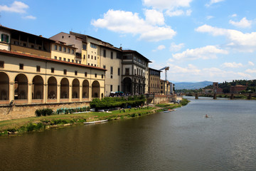 Fototapeta na wymiar Firenze, Italy - April 21, 2017: Arno river view from Ponte Vecchio, Florence, Firenze, Tuscany, Italy