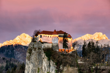 Fototapeta na wymiar Lake Bled Castle Zoomed with Triglav Mountain Slovenia