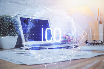 Multi exposure of blockchain and crypto economy theme hologram and table with computer background....