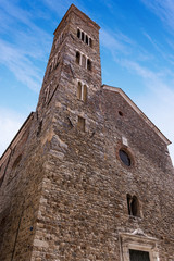 Fototapeta na wymiar Facade and bell tower of the church of Saint Andrea (X-XVI century) in Romanesque Gothic style in Sarzana town, La Spezia, Liguria, Italy, Europe