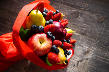 original bouquet of bright juicy fruits and berries