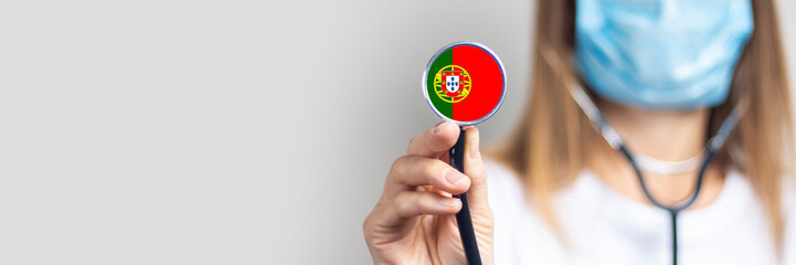 female doctor in a medical mask holds a stethoscope on a light background. Added flag of Portugal....