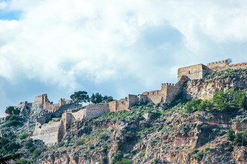 Fototapeta na wymiar old fortress on mountain, background with historical building