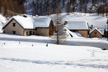 Devero Park ( Verbano-Cusio-Ossola ), Italy - January 15, 2017: Crampiolo village and houses in Alpe Devero Park, Ossola Valley, VCO, Piedmont, Italy