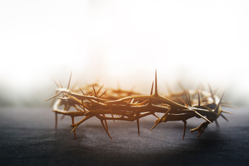 the crown of thorns of Jesus on  black background against  window light with copy space, can be used for Christian background, Easter concept - obrazy, fototapety, plakaty