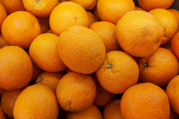 Bright oranges on a supermarket shelf