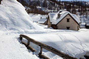 Devero Park ( Verbano-Cusio-Ossola ), Italy - January 15, 2017: Crampiolo village and houses in Alpe Devero Park, Ossola Valley, VCO, Piedmont, Italy