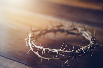 Close up of crown of thorns of Jesus on wooden table can be used for Christian concept , Easter concept with copy space