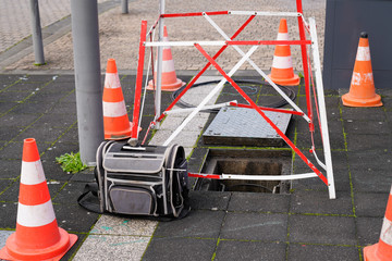 Work Fibre optic cable in city street digital fiber Internet connection cables crossing open...