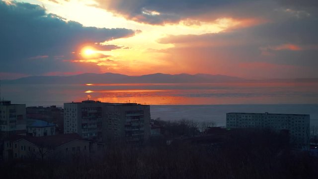 Beautiful sunset on the background of the city. Vladivostok, Russia