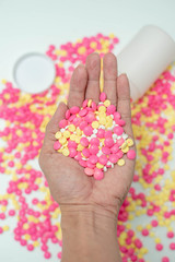 Many medicine pills on hand