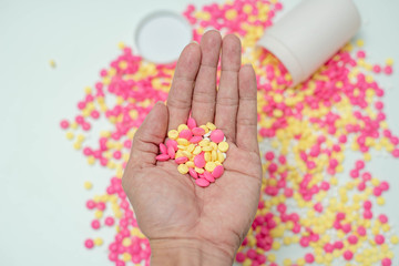 Many medicine pills on hand