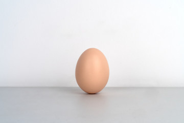 There is a raw egg on the table