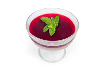 Cherry gelatin dessert with mint in glass ice cream cup