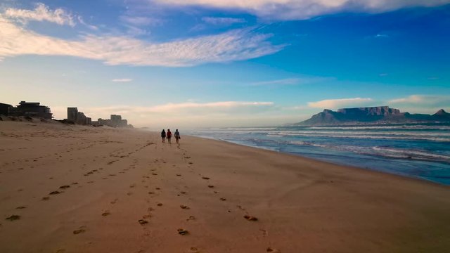 Virus outbreaks leaves a small group of people alone at the scenic beach. 
Covid 19, corona virus, empty, no people, epidemic, infection