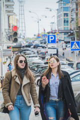 Two fashionable women walking in the street