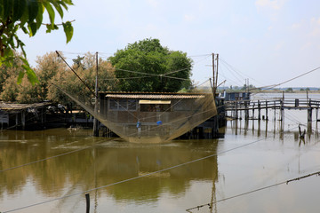 Fototapeta premium Po river (FE), Italy - April 30, 2017: An old Fisherman's house on Po river, Delta Regional Park, Emilia Romagna, Italy
