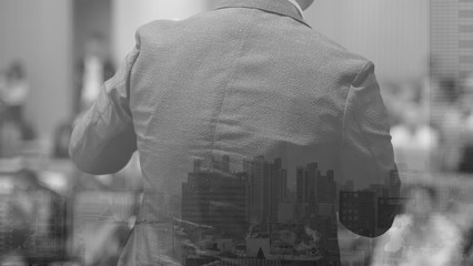 Speech given by professional speaker on stage at corporate conference. Executive manager giving presentation  to audience at leadership workshop for entrepreneurs. People receiving business education.