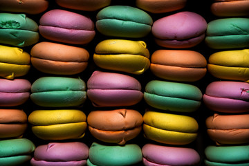 Fototapeta na wymiar Colored sweet dessert zephyr marshmallows on dark background. Air marshmallows. Confectionery.