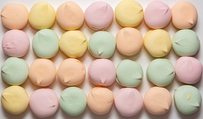 Fototapeta na wymiar Colored sweet dessert zephyr marshmallows on white background. Air marshmallows. Confectionery.