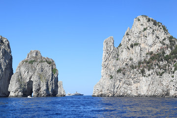 Fototapeta na wymiar Capri , Italy: The famous Faraglioni rock stacks