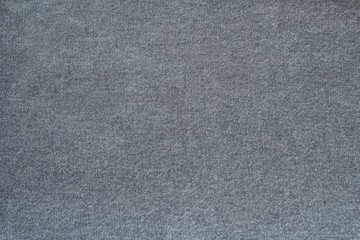 Fototapeta na wymiar Fragment of denim gray. Gray background