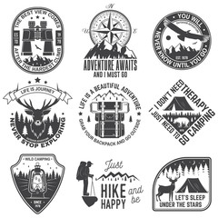 Obraz premium Set of outdoor adventure quotes symbol. Concept for shirt or logo, print, stamp or tee. Vintage design with backpack, binoculars, mountains, bear, deer, tent, lantern and forest silhouette