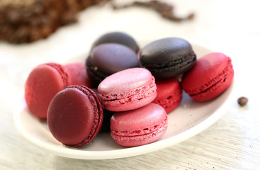 French macaroons on pastel pink background