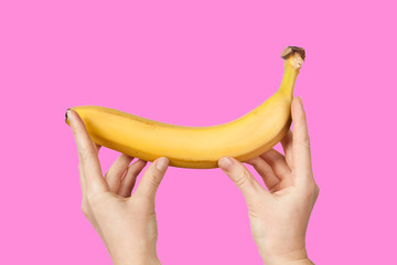 Measuring the size of a banana as a symbol of the male penis. Big dick length. Strong erection and impotence problem.