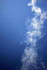 smoke towards the blue sky
