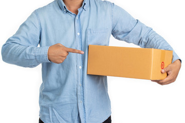 Delivery man in blue shirt holding cardboard boxes and pointing to the box isolated on white background. Express and delivery concept.
