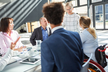 Senior woman as boss in the meeting during a lecture
