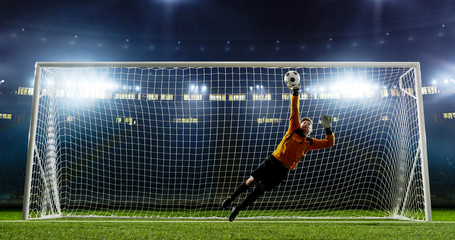 Goalkeeper is trying to save from a goal on an empty soccer stadium. No spectators on the tribunes. Stadium is made in 3d.