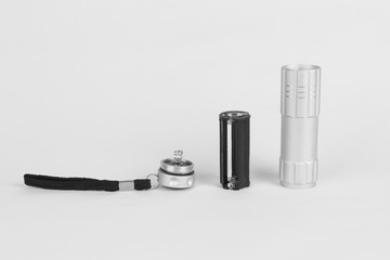 Torch light with bulb in parts at the white background