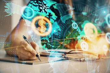 Multi exposure of woman's hands making notes with forex graph hologram. Concept of technical analysis.