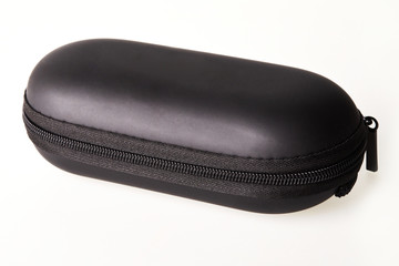 Close black protective sunglasses case on zipper isolated on white background