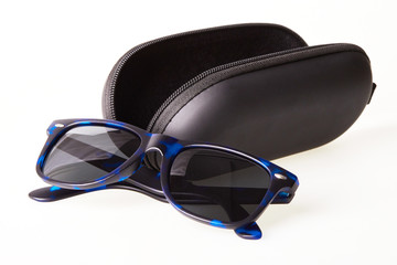 Sunglasses with black open protective  case isolated on white background