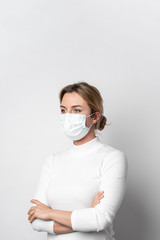 Portrait of woman with surgical mask posing