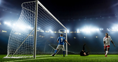 Tense game moment in front of the goal on the empty professional soccer stadium. No spectators on...