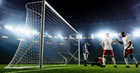 Tense game moment in front of the goal on the empty professional soccer stadium. No spectators on...