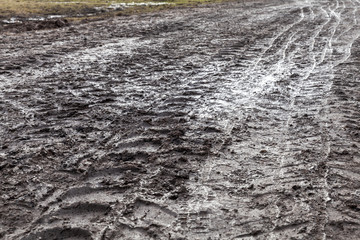 Tire tracks pattern on a wet dirty road