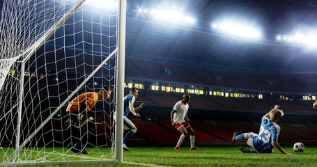 Tense game moment in front of the goal on the empty professional soccer stadium. No spectators on...