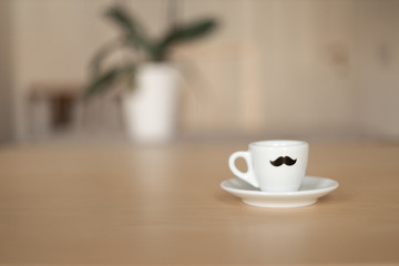 Coffee cup with flower in the background landscape format