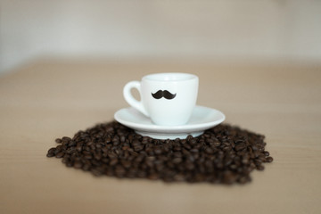Coffee cup on a mountain full of coffee beans