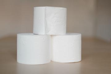 Pyramid on 3 rolls of white toilet paper