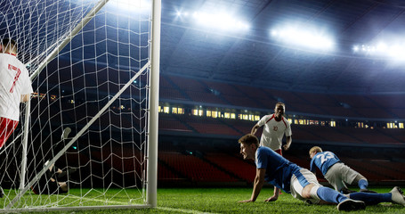 Tense game moment in front of the goal on the empty professional soccer stadium. No spectators on tribunes. Stadium is made in 3d.